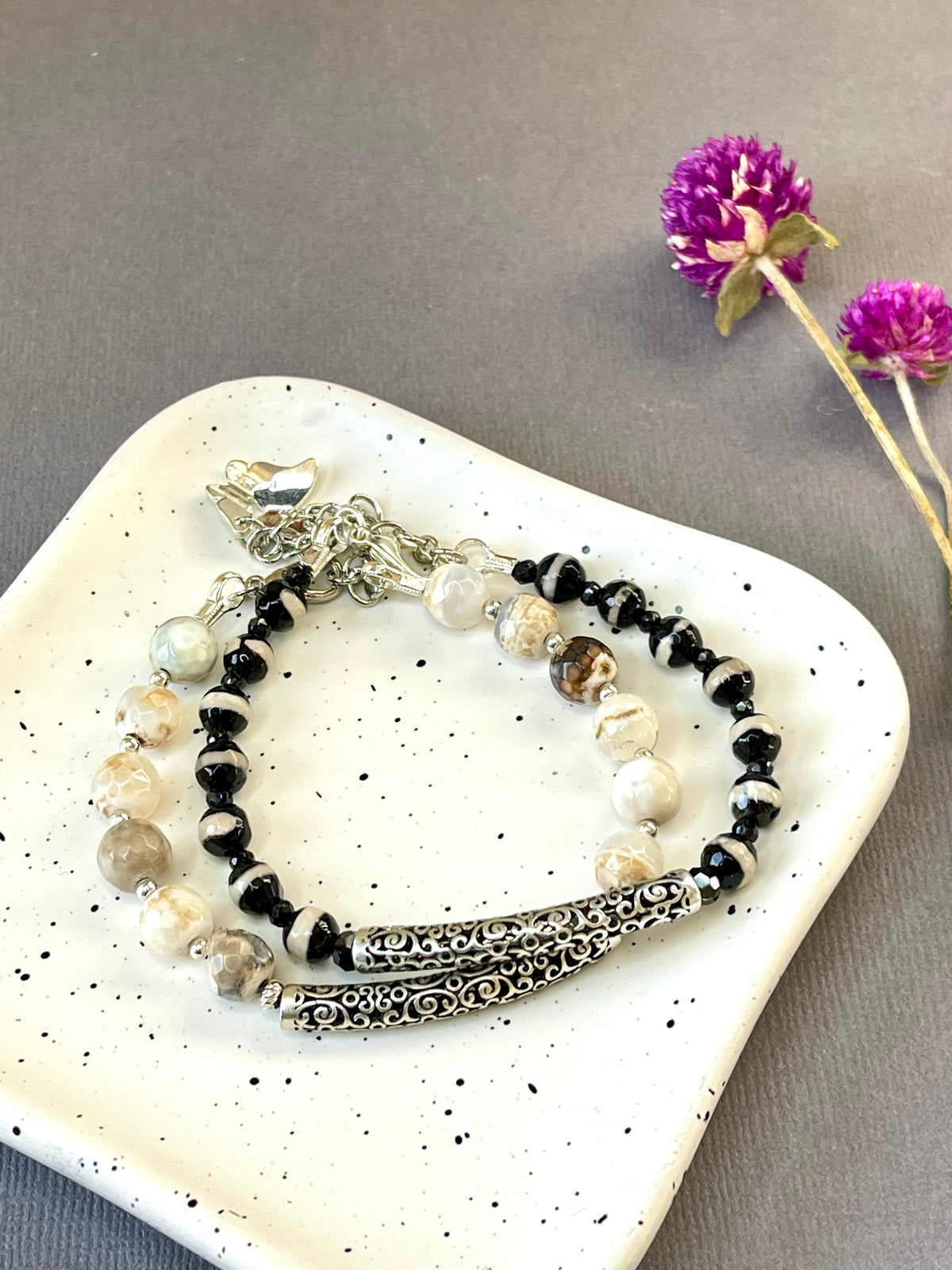  Black and white striped/ cream & brown agate bead bracelets with an ornate silver plated bars and charms
