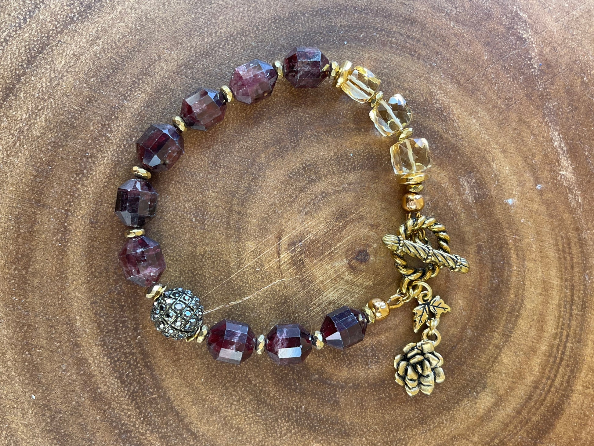Garnet beaded bracelet with floral and leaf accents