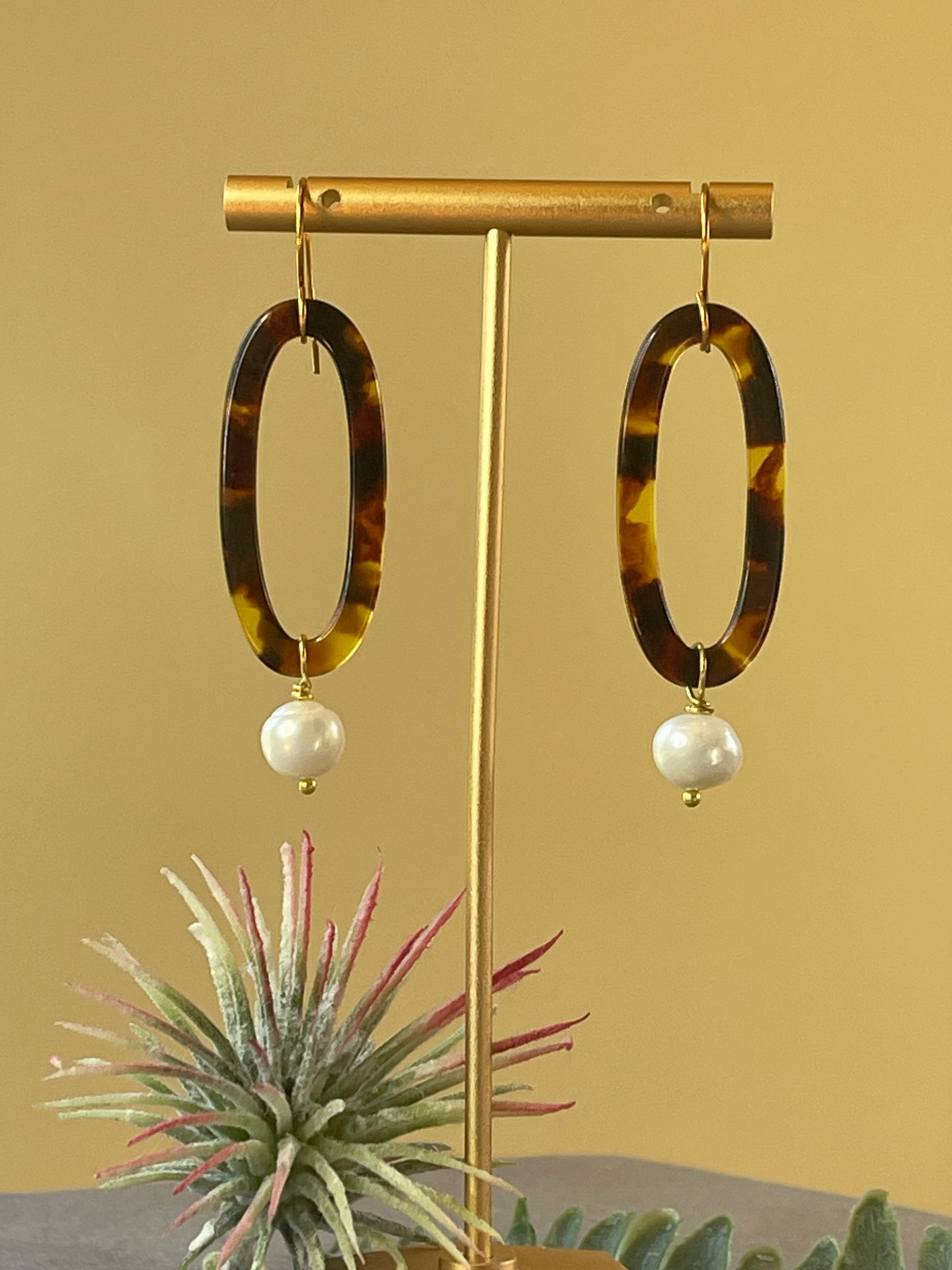 Handmade tortoise hoop earrings featuring genuine freshwater