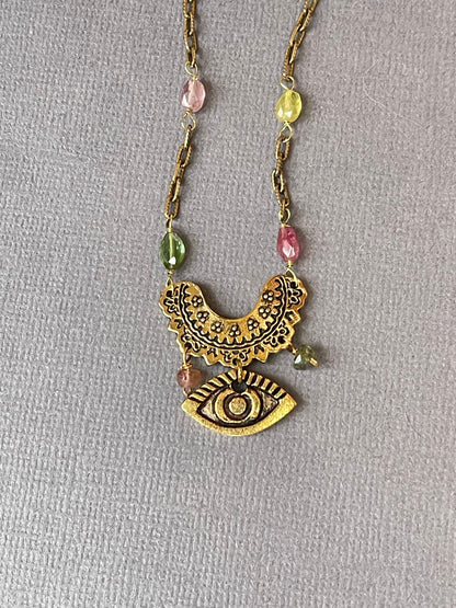 Rainbow tourmaline evil eye necklace close-up