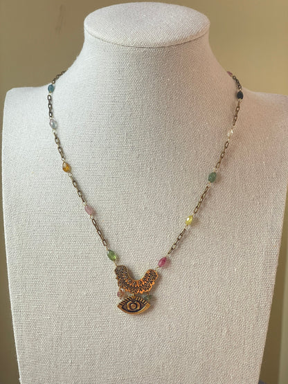Rainbow tourmaline necklace displayed on bust